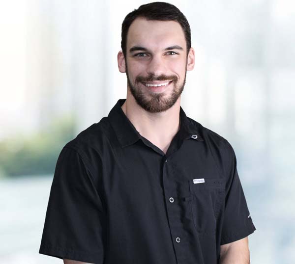 Zach Fiorito, Inside Sales representative at Practical Metals, smiling in a professional setting.